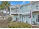 Charming two-story townhouse with dual balconies and well-manicured shrubs at 1608 Fetterbush Ln, Johns Island, SC 29455
