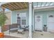 Inviting front porch featuring a seating area perfect for relaxing outdoors at 1608 Fetterbush Ln, Johns Island, SC 29455