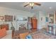 Comfortable living room featuring hardwood floors, a decorative fireplace, and an open layout at 1608 Fetterbush Ln, Johns Island, SC 29455