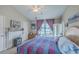 Bright main bedroom with hardwood floors and a large bed and access to balcony at 1608 Fetterbush Ln, Johns Island, SC 29455