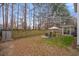 Backyard with fenced yard, patio seating area, landscaping and sunroom at 172 Paddock Way, Summerville, SC 29486