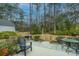 A delightful backyard with a stone patio perfect for entertaining, featuring an outdoor grill at 206 President Cir, Summerville, SC 29483