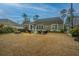 Large grassy backyard featuring a patio perfect for relaxation and entertaining at 206 President Cir, Summerville, SC 29483