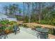 Relaxing backyard featuring patio furniture, lush landscaping, and mature trees at 206 President Cir, Summerville, SC 29483