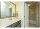 Bathroom featuring a single sink vanity, mirror, and an open door to a tub/shower combo at 206 President Cir, Summerville, SC 29483