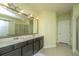 Bathroom with a double vanity, framed mirror, and tiled floors at 206 President Cir, Summerville, SC 29483