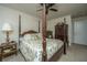 Spacious bedroom with large canopy bed, detailed wood furniture, and modern ceiling fan at 206 President Cir, Summerville, SC 29483