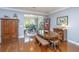 Cozy breakfast nook and dining space with a large table and lots of natural light overlooking the backyard at 206 President Cir, Summerville, SC 29483