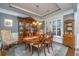 Elegant dining room with a classic wooden table, china cabinets, and refined decor at 206 President Cir, Summerville, SC 29483