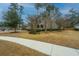 Two-story home with green siding, American flag on porch, and adjacent sidewalk at 206 President Cir, Summerville, SC 29483