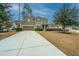 Lovely two-story home with a spacious driveway and a beautiful lawn at 206 President Cir, Summerville, SC 29483