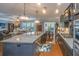 Open-concept kitchen with granite countertops, stainless steel appliances, and hardwood floors at 206 President Cir, Summerville, SC 29483