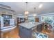 Open-concept kitchen featuring a large island, stainless steel appliances, and seamless flow to the living area at 206 President Cir, Summerville, SC 29483