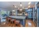 Spacious kitchen with a granite island, modern appliances, and a breakfast bar for casual dining at 206 President Cir, Summerville, SC 29483