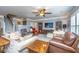 Inviting living room with plentiful seating, ceiling fan and view to stairway at 206 President Cir, Summerville, SC 29483