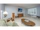 Large living room area with a TV, comfortable seating, and carpet floors at 206 President Cir, Summerville, SC 29483