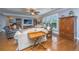 Comfortable living room with ceiling fan and large windows to the backyard at 206 President Cir, Summerville, SC 29483
