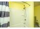 Bright white shower featuring a mounted shower head, new hardware, and striped shower curtain at 206 President Cir, Summerville, SC 29483
