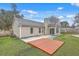 Exterior view of the back of the home featuring a deck, patio, and yard at 209 Persimmon Cir, Goose Creek, SC 29445