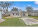 A cozy backyard featuring a patio, deck, and a circular gravel area, perfect for outdoor relaxation and entertainment at 209 Persimmon Cir, Goose Creek, SC 29445