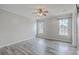 This bedroom features wood-look flooring and dual windows that let in lots of natural light at 209 Persimmon Cir, Goose Creek, SC 29445