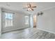 Comfortable bedroom with hardwood floors, a ceiling fan, and ensuite bathroom at 209 Persimmon Cir, Goose Creek, SC 29445