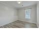 Bedroom showcasing wood-look floors, neutral walls, and a window at 209 Persimmon Cir, Goose Creek, SC 29445