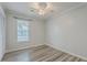 This bedroom features wood-look floors, a ceiling fan and ample natural light at 209 Persimmon Cir, Goose Creek, SC 29445