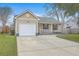 Charming single-story home with a well-manicured lawn and a one-car garage at 209 Persimmon Cir, Goose Creek, SC 29445