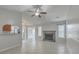 Spacious living room featuring a cozy fireplace, tiled floors, and natural light at 209 Persimmon Cir, Goose Creek, SC 29445