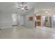 Open-concept living room connected to the kitchen with tile floors and vaulted ceilings at 209 Persimmon Cir, Goose Creek, SC 29445