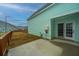 Enclosed backyard featuring a concrete patio, lawn area, string lights, and privacy fence at 219 Corvus St, Summerville, SC 29483