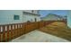 Fenced backyard featuring brown wooden fence and concrete patio, creating a private outdoor space for relaxing at 219 Corvus St, Summerville, SC 29483