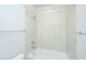 Bright and clean tiled bathtub and shower combination with modern fixtures and towel bar at 219 Corvus St, Summerville, SC 29483