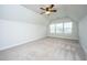 Spacious bedroom with vaulted ceiling, three windows, and plush carpet at 219 Corvus St, Summerville, SC 29483