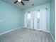 Bedroom painted a soft green, with carpet, two windows, and light-blocking curtains at 219 Corvus St, Summerville, SC 29483