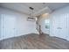 Hallway with hardwood floors, a modern light fixture, and access to stairs at 219 Corvus St, Summerville, SC 29483