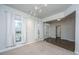 Inviting living room with plush carpet, natural light from large windows, and open entryway at 219 Corvus St, Summerville, SC 29483