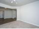 Bright living room featuring neutral carpet, modern lighting, and crisp white trim at 219 Corvus St, Summerville, SC 29483