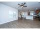 Bright, open living area features hardwood floors and views into the modern kitchen at 219 Corvus St, Summerville, SC 29483