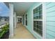 Inviting porch with white columns and light blue walls, offering a charming outdoor space at 219 Corvus St, Summerville, SC 29483