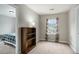 Neutral bedroom with a view to a second room, large window, and a minimal aesthetic at 223 Chipping Sparrow Drive Dr, Summerville, SC 29485