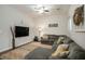 Cozy living room with gray sectional sofa, patterned rug, and modern decor at 223 Chipping Sparrow Drive Dr, Summerville, SC 29485