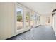 Enclosed sunroom featuring large windows that offer ample light and views of the outdoors at 2367 United Dr, Huger, SC 29450