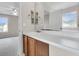 Bathroom vanity with sink, mirror, cabinets and view into bedroom with ceiling fan at 244 Dunning Rd, Summerville, SC 29486