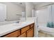 Bathroom featuring a single vanity with a white countertop, a mirror, and a shower at 244 Dunning Rd, Summerville, SC 29486