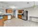 Open kitchen with stainless steel appliances, tile floor, green counters and view to laundry area at 244 Dunning Rd, Summerville, SC 29486