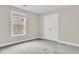 Cozy bedroom featuring a large window, closet, and plush carpet ready for personal touch at 295 Calm Water Way, Summerville, SC 29486