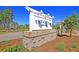A neighborhood sign with brick base welcomes residents and visitors to 'The Coves' at 295 Calm Water Way, Summerville, SC 29486
