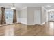 Open dining room features elegant wainscoting, hardwood floors, and large windows at 295 Calm Water Way, Summerville, SC 29486